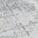 Close-up of the Eltham Thick Luxe Rug showing its plush texture and abstract pattern in light gray and white. Texture