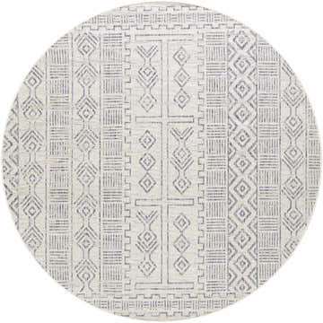 Close-up of the Epson Indoor & Outdoor Rug in a round shape. The rug has a bohemian geometric pattern in off white and navy. Design-Round-710