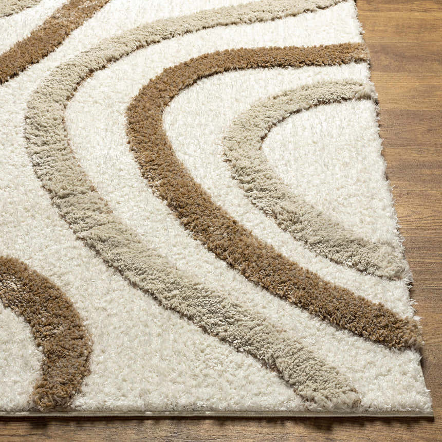 Close-up of the Espiye Area Rug showing the driftwood and dark brown wavy stripes and soft, shag texture. Front