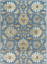 Close-up of the Fanny Area Rug. Hand-tufted wool rug in beachhouse blue with beige, caramel, and copper floral pattern. Design-Rectangle-811