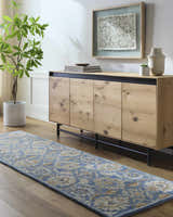 Entryway with a blue and beige floral Fanny Area Rug, wood console table, and modern decor. Roomscene-Runner