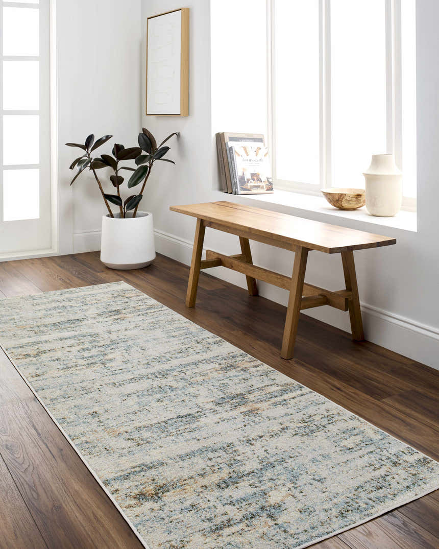 Entryway with wood floors and Aletta Washable Rug runner in beige, blue, and off white. Bench, plant, and natural light. Roomscene-Runner