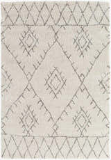 Close-up of the Flintville Moroccan Shag Area Rug. The rug has a light beige base and a charcoal diamond pattern. Design-Rectangle