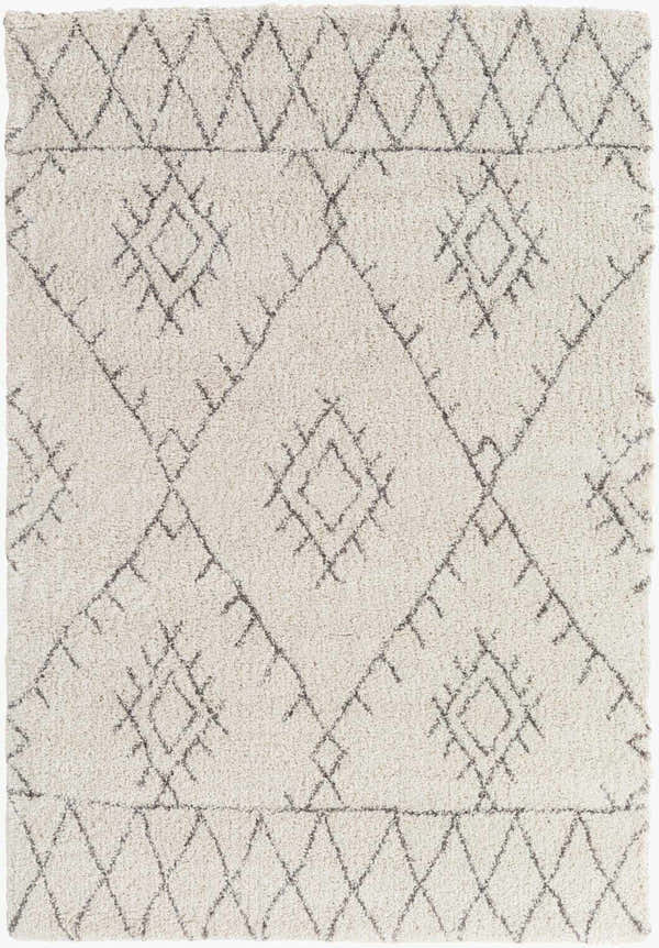 Close-up of the Flintville Moroccan Shag Area Rug. The rug has a light beige base and a charcoal diamond pattern. Design-Rectangle