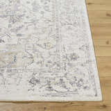 Close-up of the Alissa Cream Area Rug showing its traditional charcoal, gray, and tan floral pattern and soft texture. Front