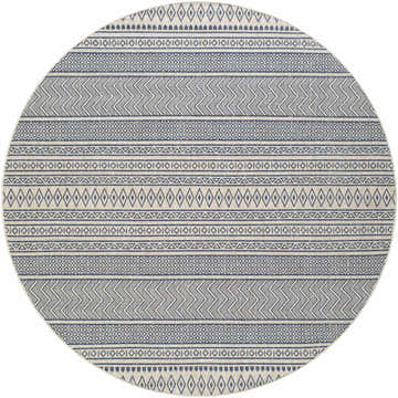 Close-up of a round Madras Ink All Over Performance Rug. Features a geometric pattern in ink and natural gray tones. Design-Round-710
