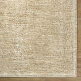 Close-up of the Antoan Sandstone Area Rug, a machine-woven rug in ivory, sandstone, and taupe with a traditional pattern. Corner