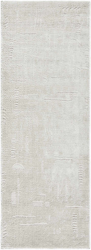 Close-up of the ivory Winda Area Rug. The rug has a subtle, contemporary pattern and a soft, textured pile. Design-Runner-2773