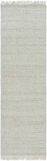 Close-up of the Sorell Sage Rug, a hand-woven wool rug with a textured ecru and sage weave and fringed edges. Design-Runner-268