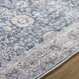 Close-up of the Mary Machine Woven Vivir x LIVABLISS VVMR-2300 Area Rug showing its beige, black, and rust traditional pattern. Texture