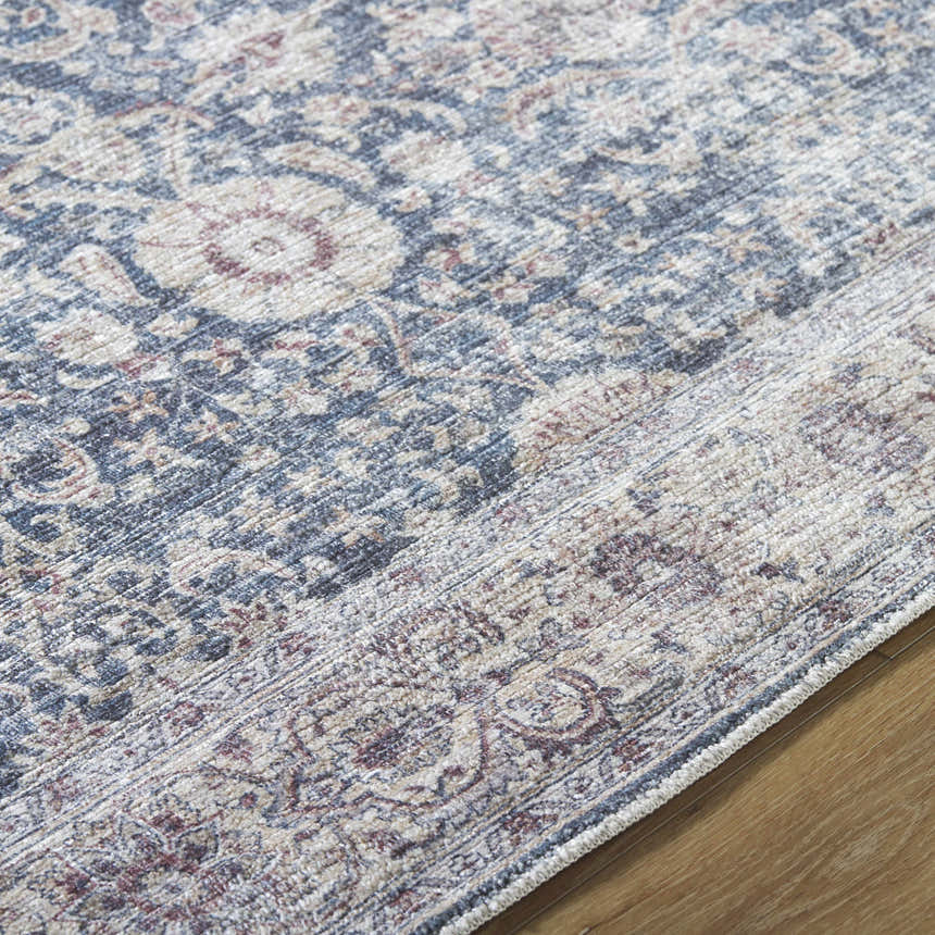 Close-up of the Mary Machine Woven Vivir x LIVABLISS VVMR-2300 Area Rug showing its beige, black, and rust traditional pattern. Texture