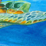 Close up of Dalyn Harbor Ocean rug, watercolor sea turtle design in shades of blue, green, and brown.