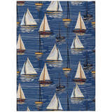 Dalyn Harbor Navy Washable Area Rug close-up. Coastal style with sailboat pattern, navy background, and beige, black, and gold accents.
