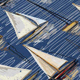 Close-up of Dalyn Harbor Navy Washable Area Rug with sailboat pattern in beige, gold, and black on a navy background. Coastal style.