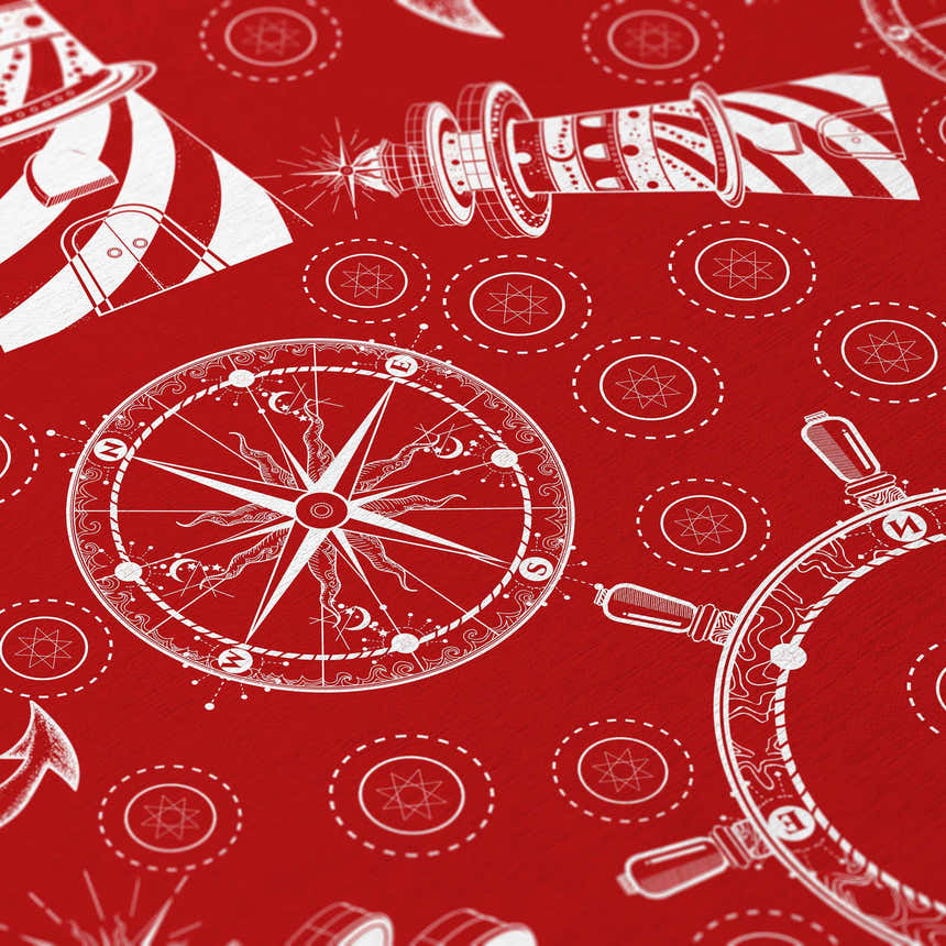 Close-up of Dalyn Harbor HA9 Red Washable Area Rug featuring a white nautical compass, ship wheel, and lighthouse design.