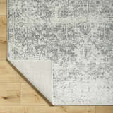 Close-up of Livabliss Harput HAP-1024 area rug; charcoal, medium gray, and off-white farmhouse traditional design. Fold