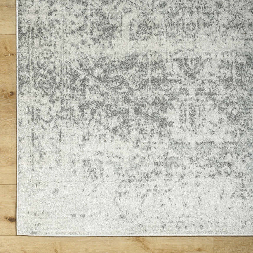 Close-up of the Livabliss Harput HAP-1024 area rug. Charcoal and off-white traditional pattern on a soft polypropylene texture. Corner