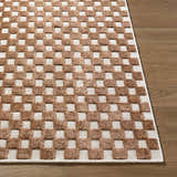 Close-up of the Anthea White Washable Area Rug. Brown and white checkerboard pattern with a textured, machine-woven design. Front