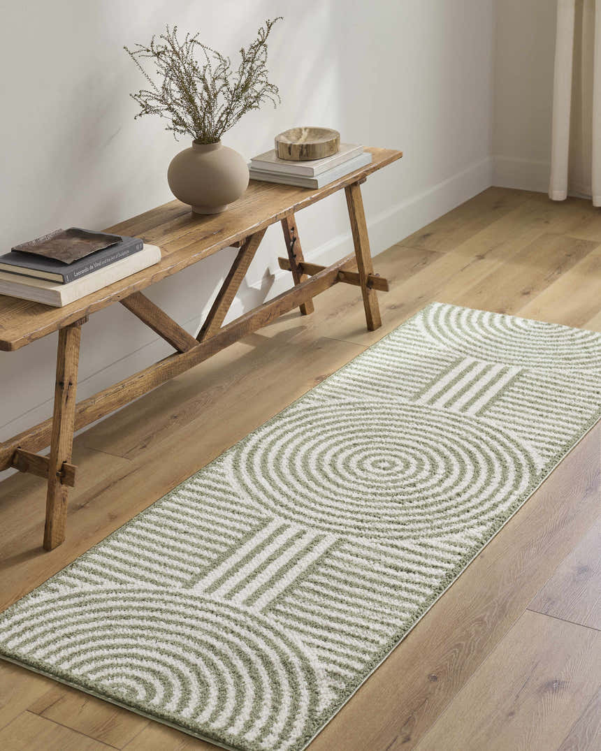 Entryway with wood floors and Allard Green Washable Area Rug. Rustic bench with books and vase. Contemporary style. Roomscene-Runner