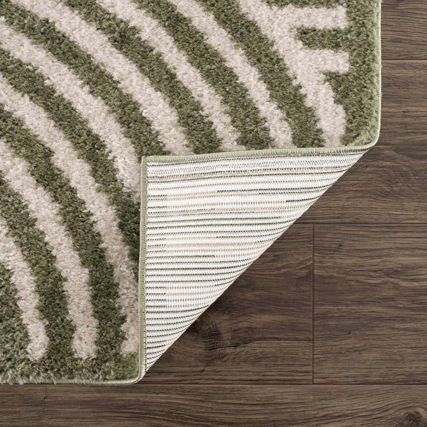 Close-up of the Allard Green Washable Area Rug showing its lime green and cream striped pattern and machine woven construction. Fold