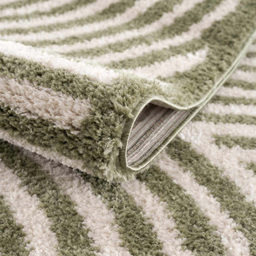 Close-up of the Allard Green Washable Area Rug showing its lime green and peach striped pattern and soft, textured pile. Fold