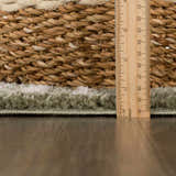 Close-up of the Allard Green Washable Area Rug showing its texture, pile height, and construction details. Pile