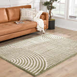 Living room scene with Allard Green Washable Area Rug, tan leather couch, and modern decor. Fresh, contemporary style. Roomscene-Rectangle