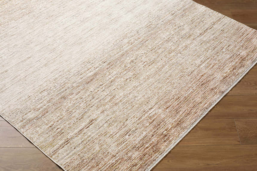 Close-up of the Amaury Area Rug, a farmhouse style rug in cream, dark brown, and medium gray on hardwood floor. Corner