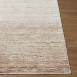Close up of the cream, brown, and gray textured Amaury Area Rug on wood flooring. Front