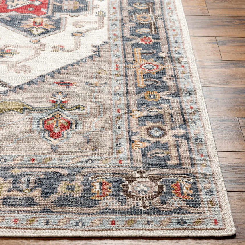 Close-up of the Halayhayin Premium Rug showing its traditional, hand-knotted design with brick red, brown, and cream colors. Front
