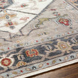 Close up of the Halayhayin Premium Rug featuring a traditional pattern in cream, gray, red, and blue. Texture