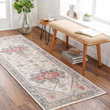 Hallway scene with a cream, brick red, and gray Halayhayin Premium Rug runner, wood bench, and hardwood floors. Roomscene-Runner
