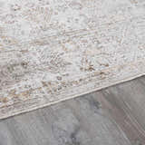 Close-up of the Galey Alix x Livabliss Myrtle Avenue I Area Rug. Cream rug with vintage oriental design and taupe, brown, and olive accents. Pile