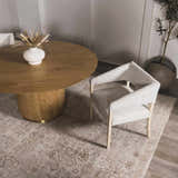 Dining room scene with a Galey Alix x Livabliss Myrtle Avenue rug, round wood table, and modern chair. Neutral, boho style. Roomscene-Rectangle