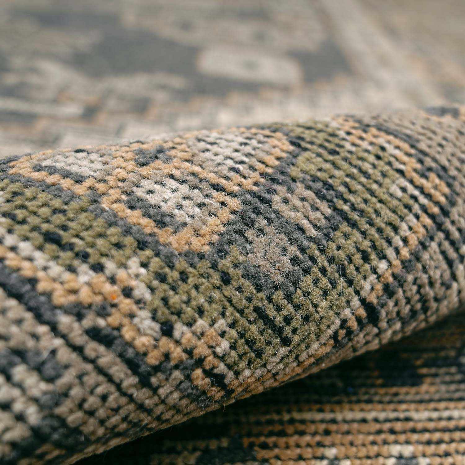 Folded section of Huntspill Traditional Premium Wool Area Rug, displaying material thickness and weave. Traditional Area Rug Backing  