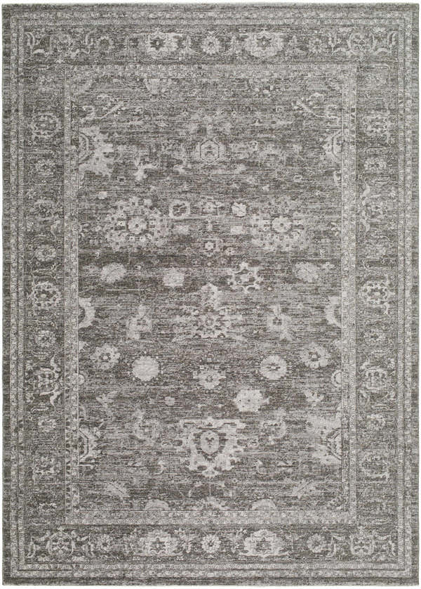 Close-up of the Haruna Area Rug, a machine-woven, rectangular rug with a traditional gray floral pattern and farmhouse style. Design-Rectangle-679