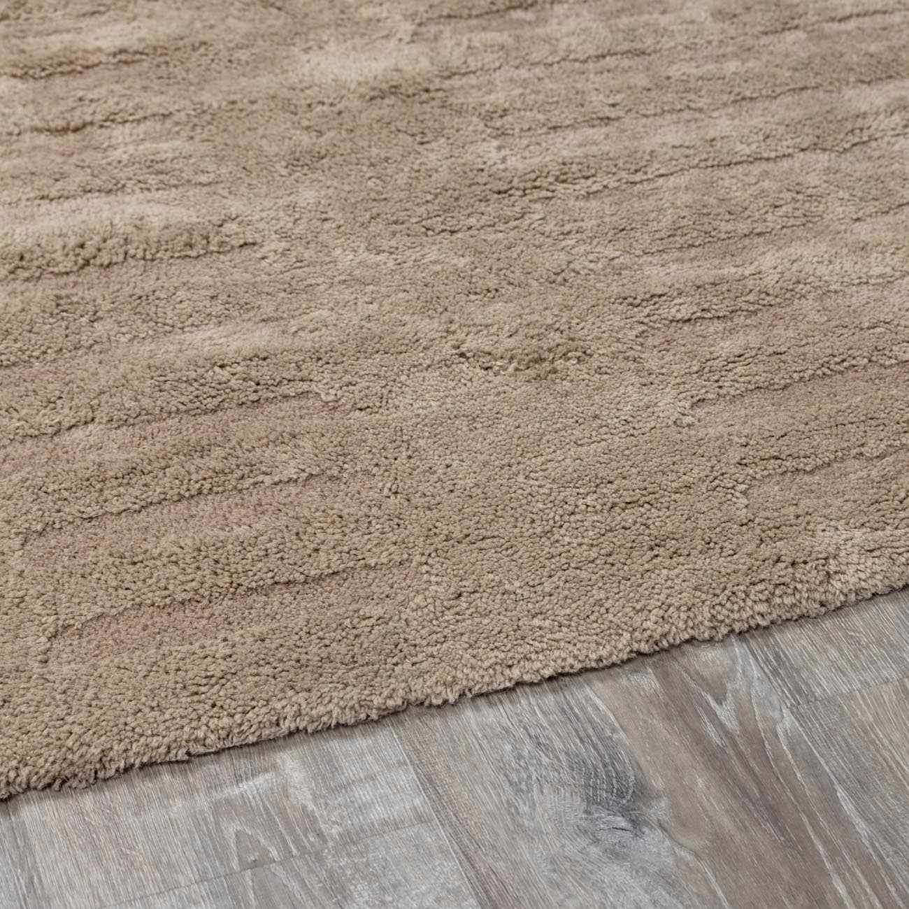 Detailed look at the pile on Washable Handmade Wool Rug - Brown, showcasing its softness and plushness. Contemporary, Broken Striped, Textured Area Rug Backing  