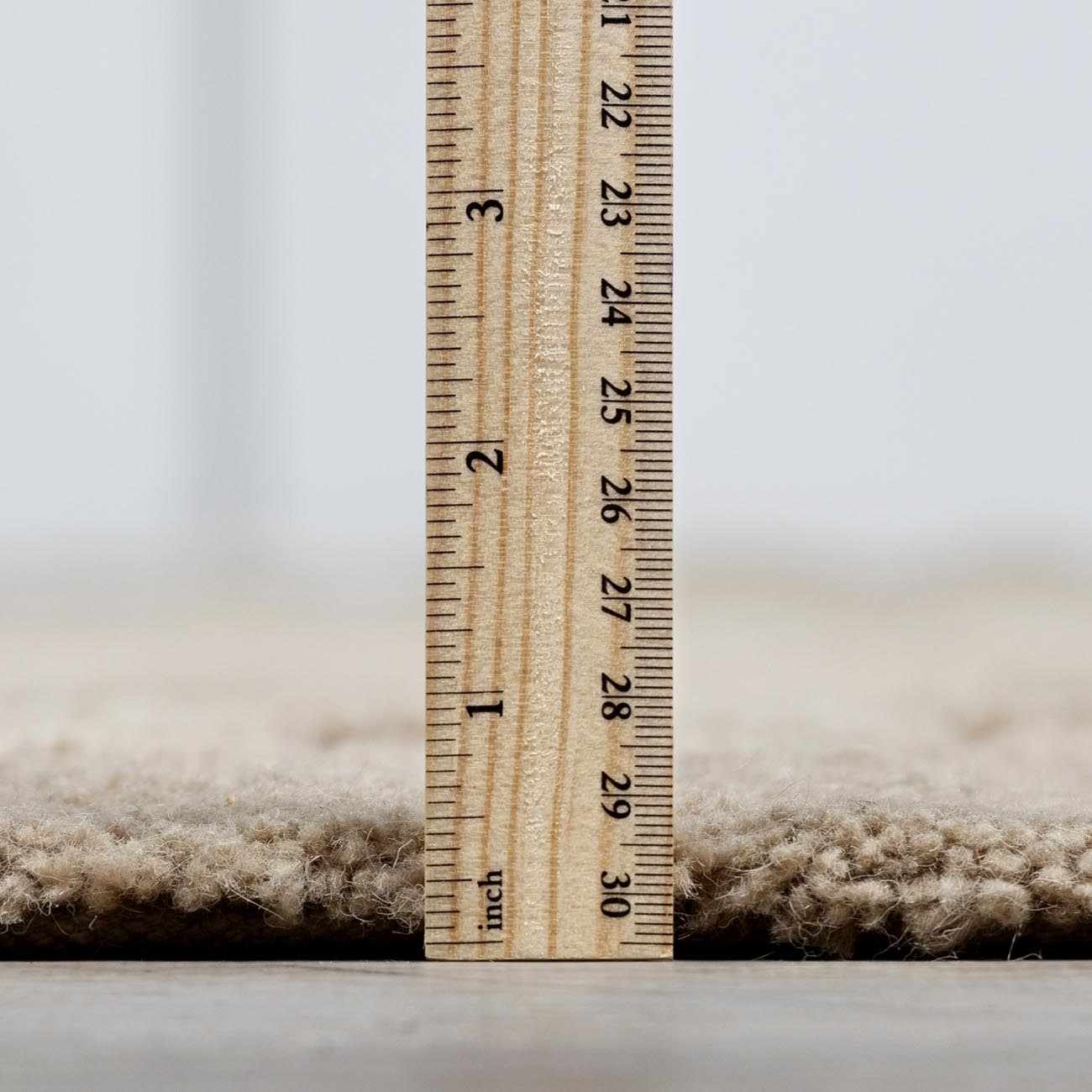 Detailed look at the pile on Washable Handmade Wool Rug - Brown, showcasing its softness and plushness. Contemporary, Broken Striped, Textured Area Rug Backing  