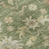 Close-up of Dalyn Luxury Hatay HY2 Aloe Washable Area Rug. Green rug with beige, caramel, and sage floral pattern.