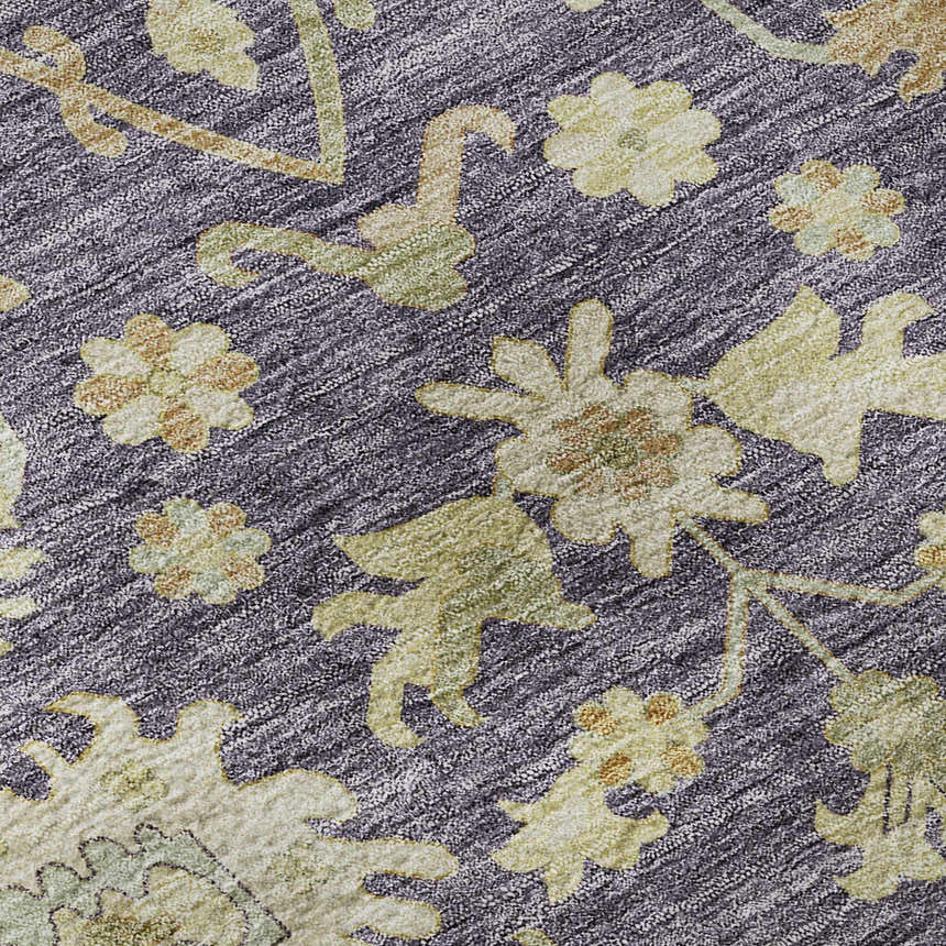 Close-up of the Dalyn Luxury Hatay HY2 Eggplant Washable Area Rug, featuring a floral pattern in beige, gold, and sage on a dark purple ground.