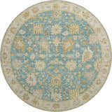 Close-up of the round Dalyn Luxury Hatay HY2 Teal Washable Area Rug, featuring beige, gold, and blush pink floral patterns.