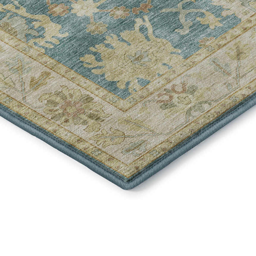 Close-up of Dalyn Luxury Hatay HY2 Teal Washable Area Rug. Features a traditional floral pattern in teal, beige, and blush pink.
