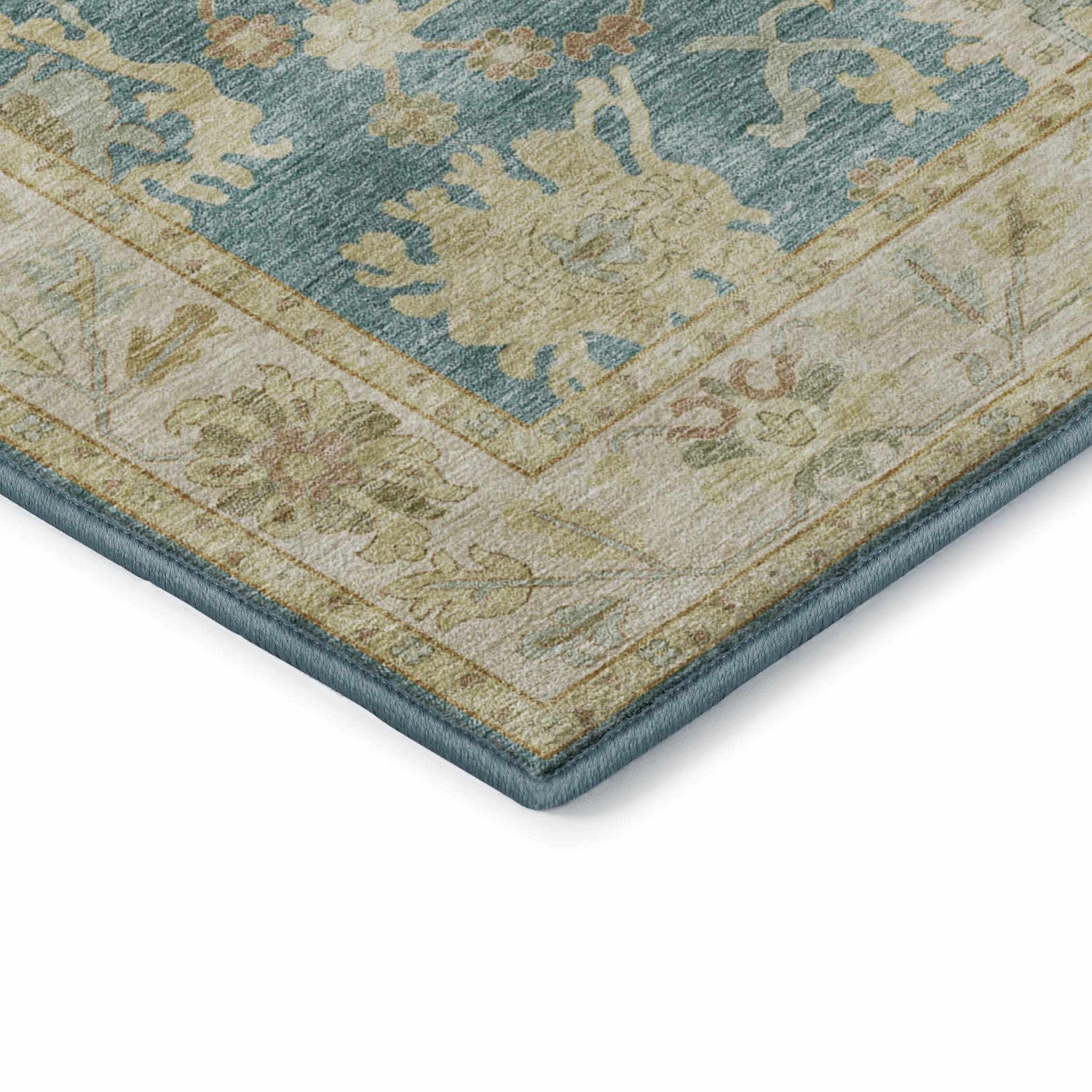 Close-up of Dalyn Luxury Hatay HY2 Teal Washable Area Rug. Features a traditional floral pattern in teal, beige, and blush pink.