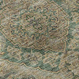 Close-up of the Dalyn Luxury Hatay HY3 Emerald Washable Area Rug featuring a traditional beige, gold, and light green pattern.