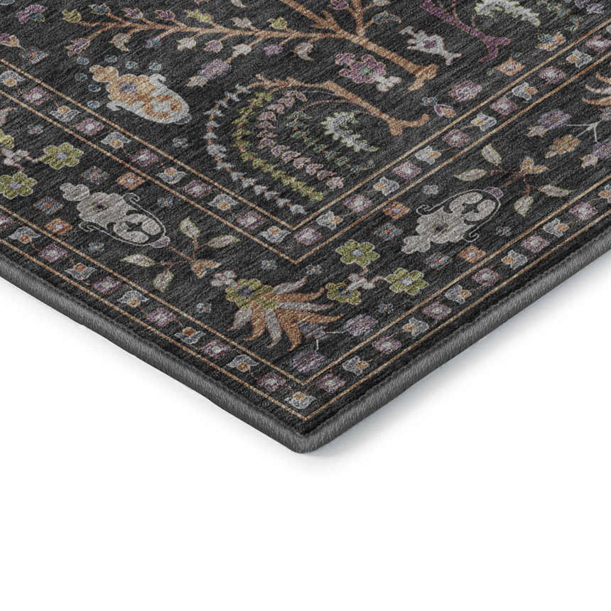 Close-up of the Dalyn Luxury Hatay HY5 Black Washable Area Rug, showing its floral pattern and black, green, and purple colors.
