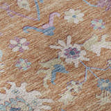 Close up of the Dalyn Luxury Hatay HY7 Orange Washable Area Rug showcasing floral design, and orange, pink, and blue colors.