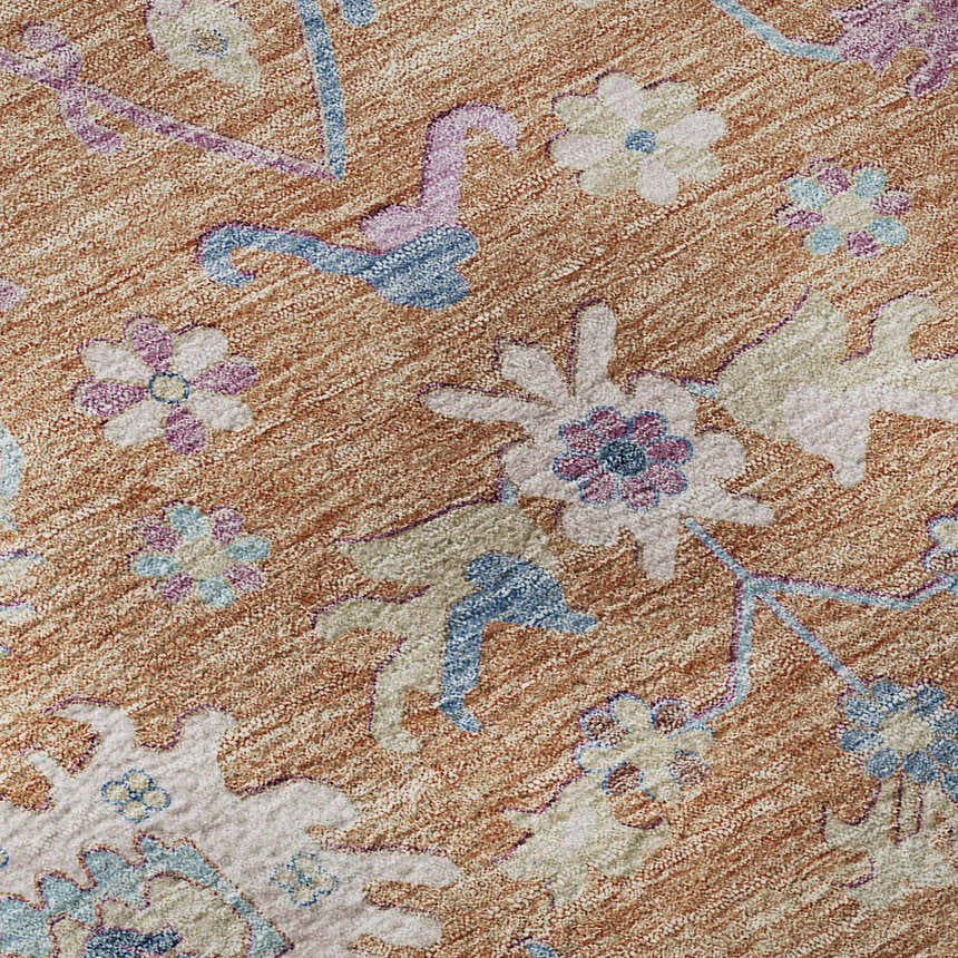 Close up of the Dalyn Luxury Hatay HY7 Orange Washable Area Rug showcasing floral design, and orange, pink, and blue colors.