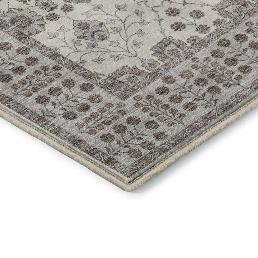 Close up of the Dalyn Luxury Hatay HY8 Ivory Washable Area Rug, showing floral pattern and beige, brown, ivory, and taupe colors.