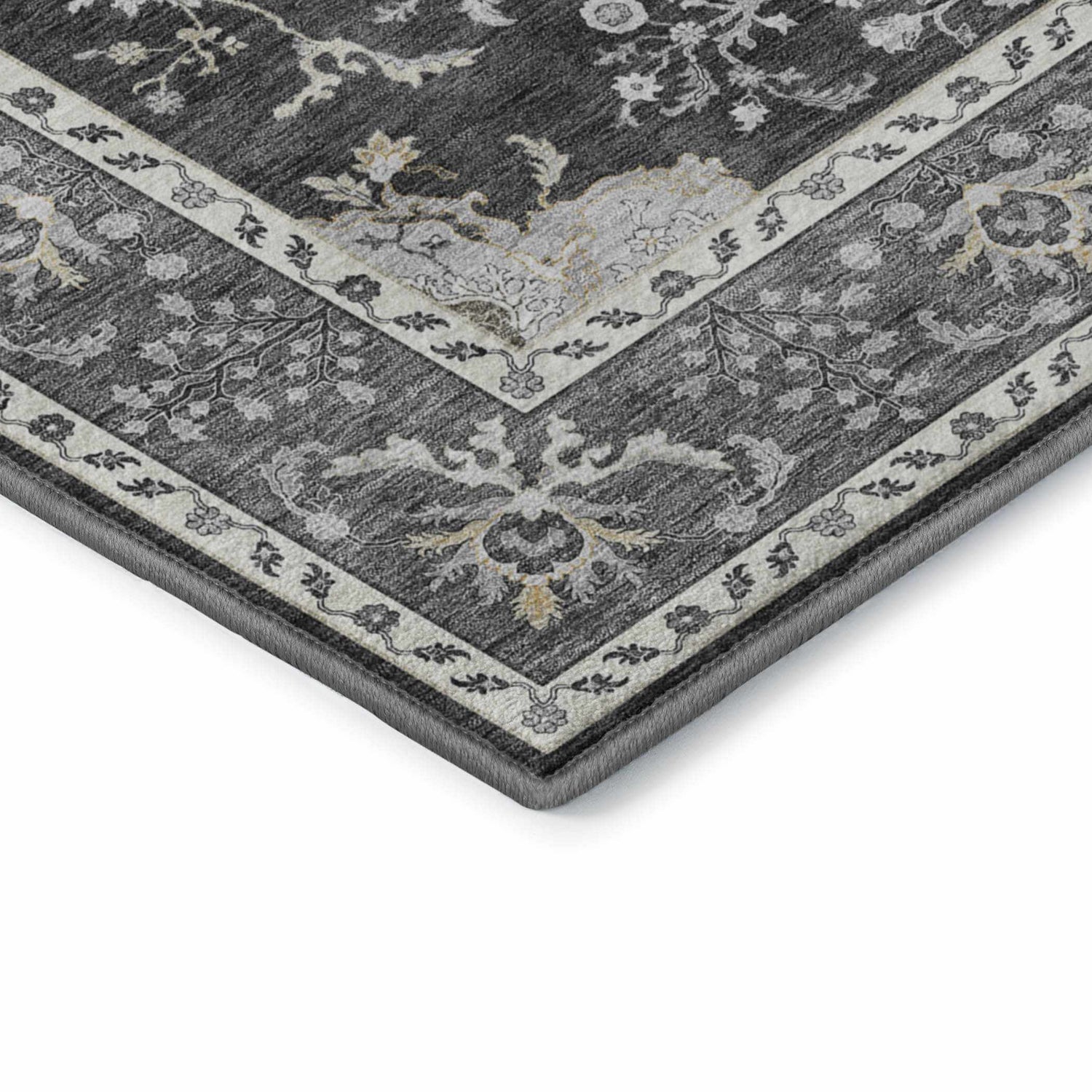 Close-up of the Dalyn Luxury Hatay HY9 Charcoal Washable Area Rug featuring a traditional floral pattern in charcoal, silver gray, and gold.