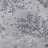 Close-up of the Dalyn Luxury Hatay HY9 Lavender Washable Area Rug. Features a traditional floral pattern in purple, gold, and taupe.